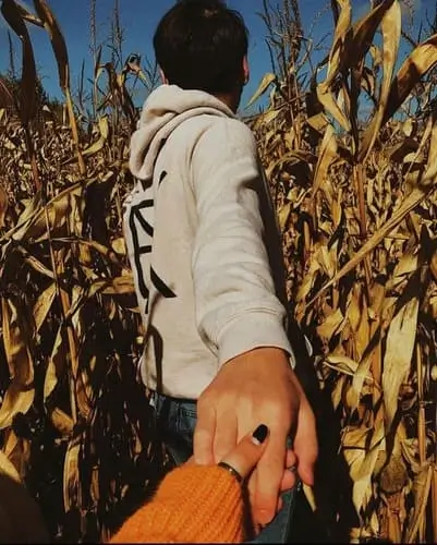 Fun Halloween date night idea at a nighttime corn maze, perfect for couples looking for a spooky, adventurous fall activity to enjoy together.