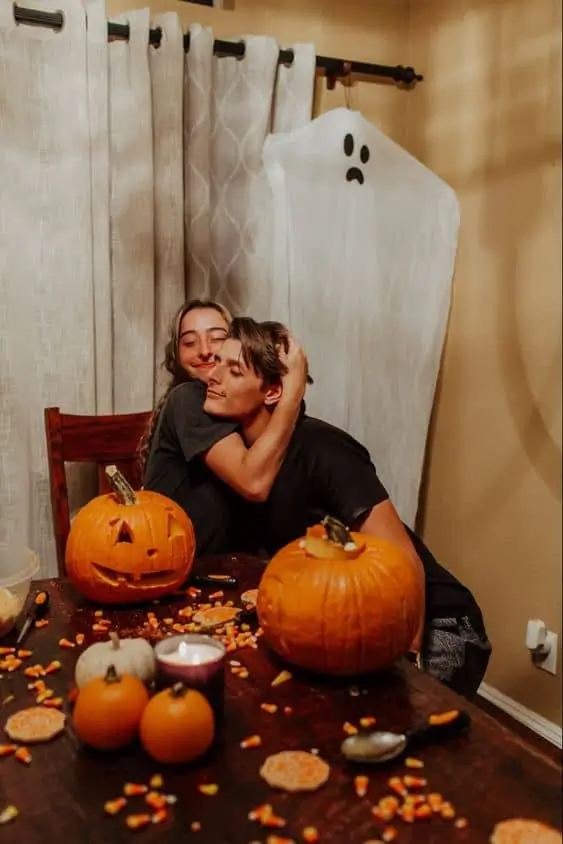 Carve pumpkins together for a cute halloween date night idea that you can post on instagram and tik tok