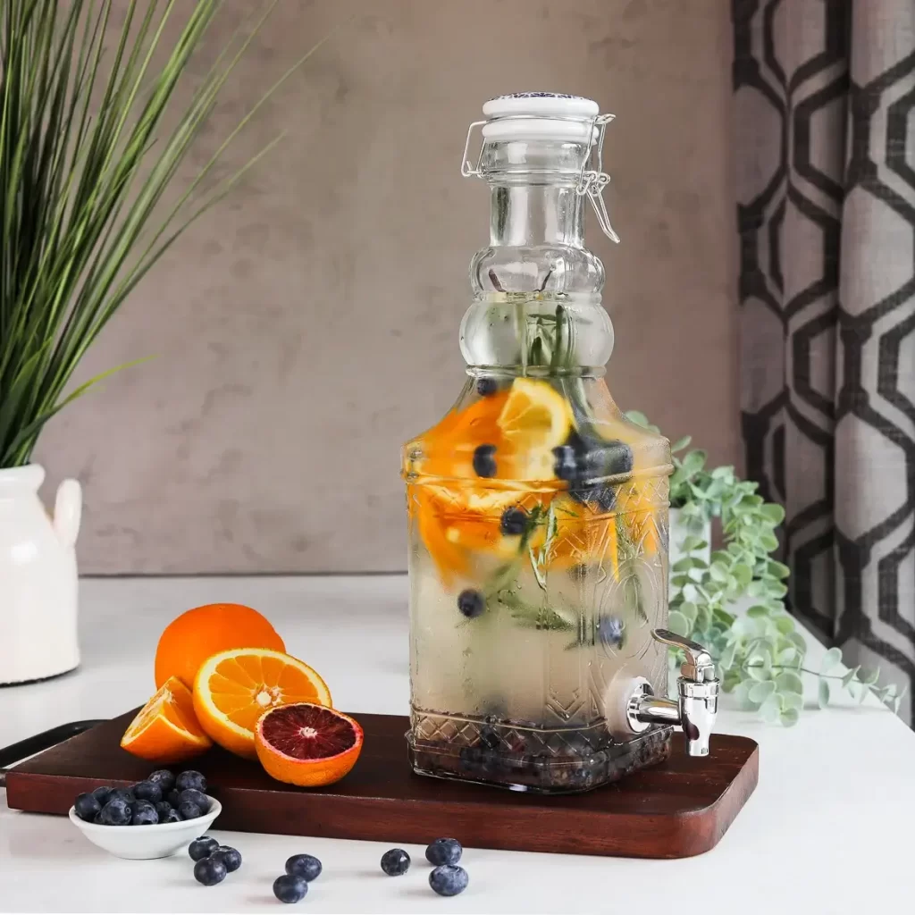 Blueberry orange water in a drink dispenser
