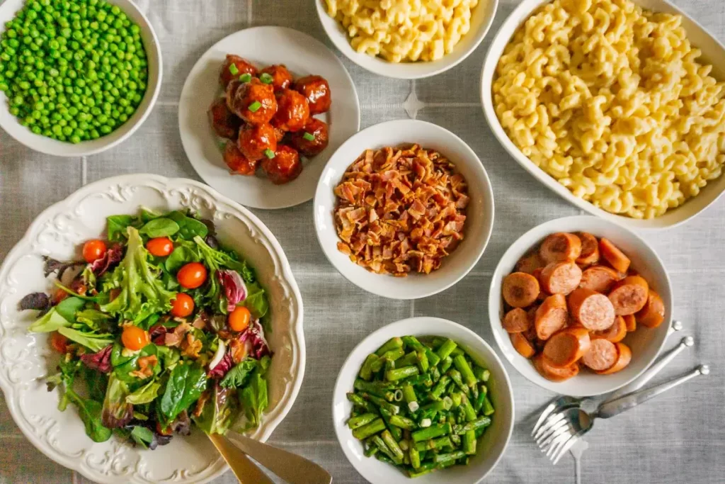 Gourmet macaroni and cheese bar with various toppings and everything set out