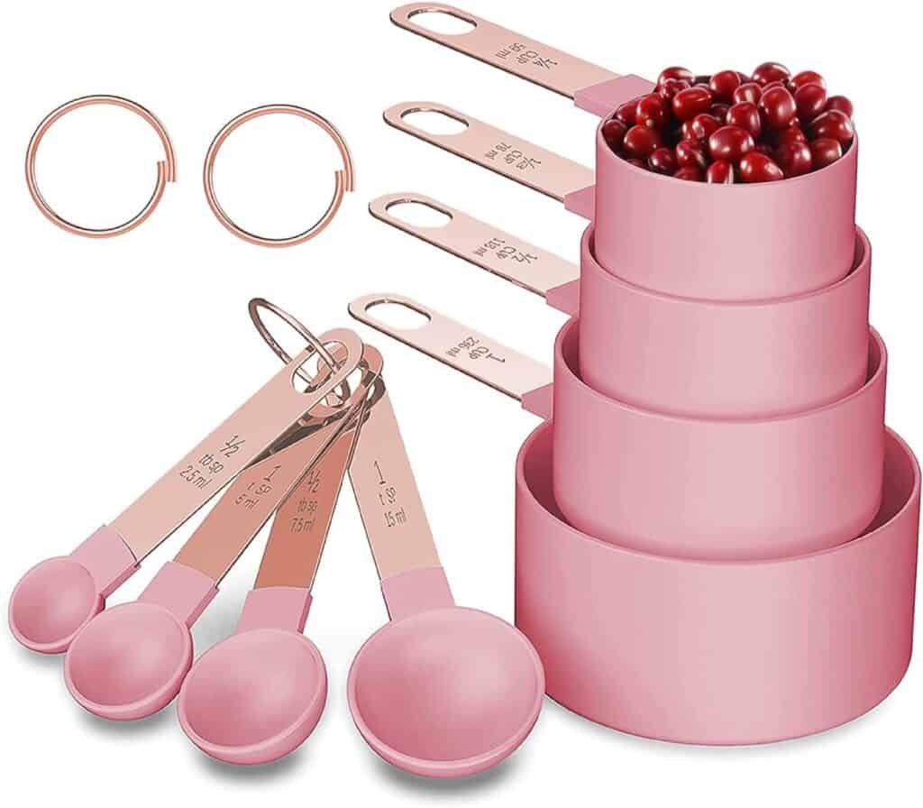 pink and rose gold measuring cups and spoons