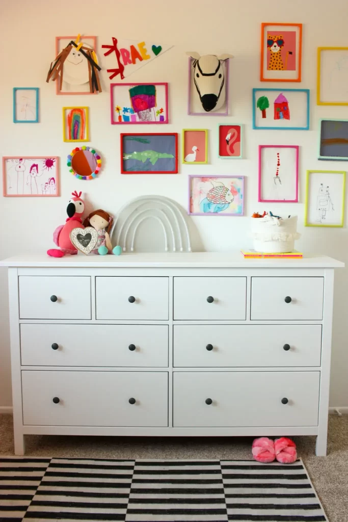 Feature your child's art in their room by creating a gallery wall. This is a great way to feature their art projects