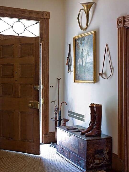 Entryway with horse-inspired wall accents that give an old country feel