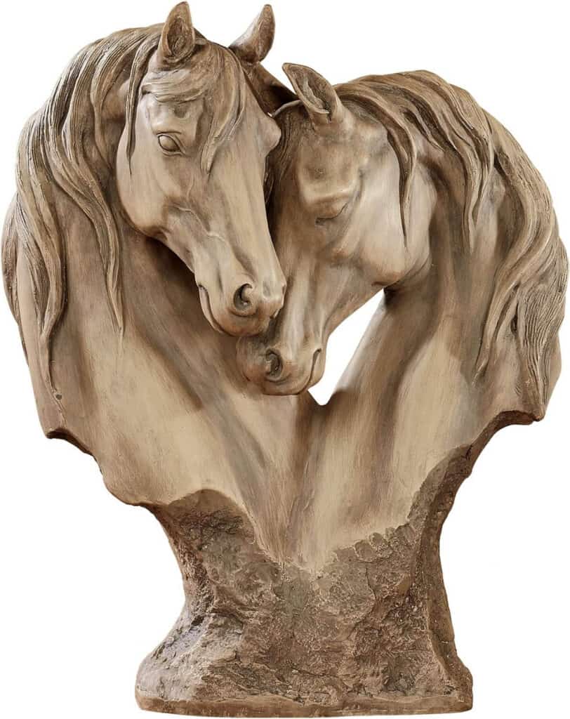 Horses nuzzling statue
