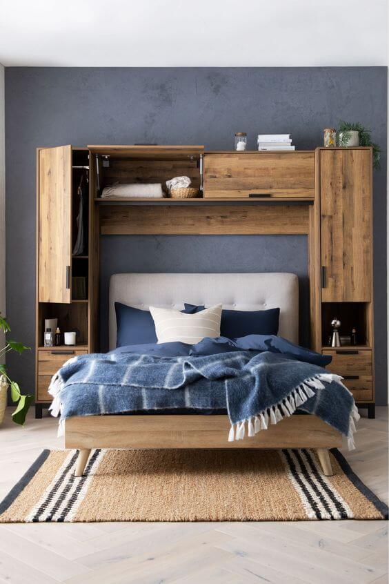 Above-bed storage with surrounding cabinets that is a great solution if you're working with a smaller bedroom