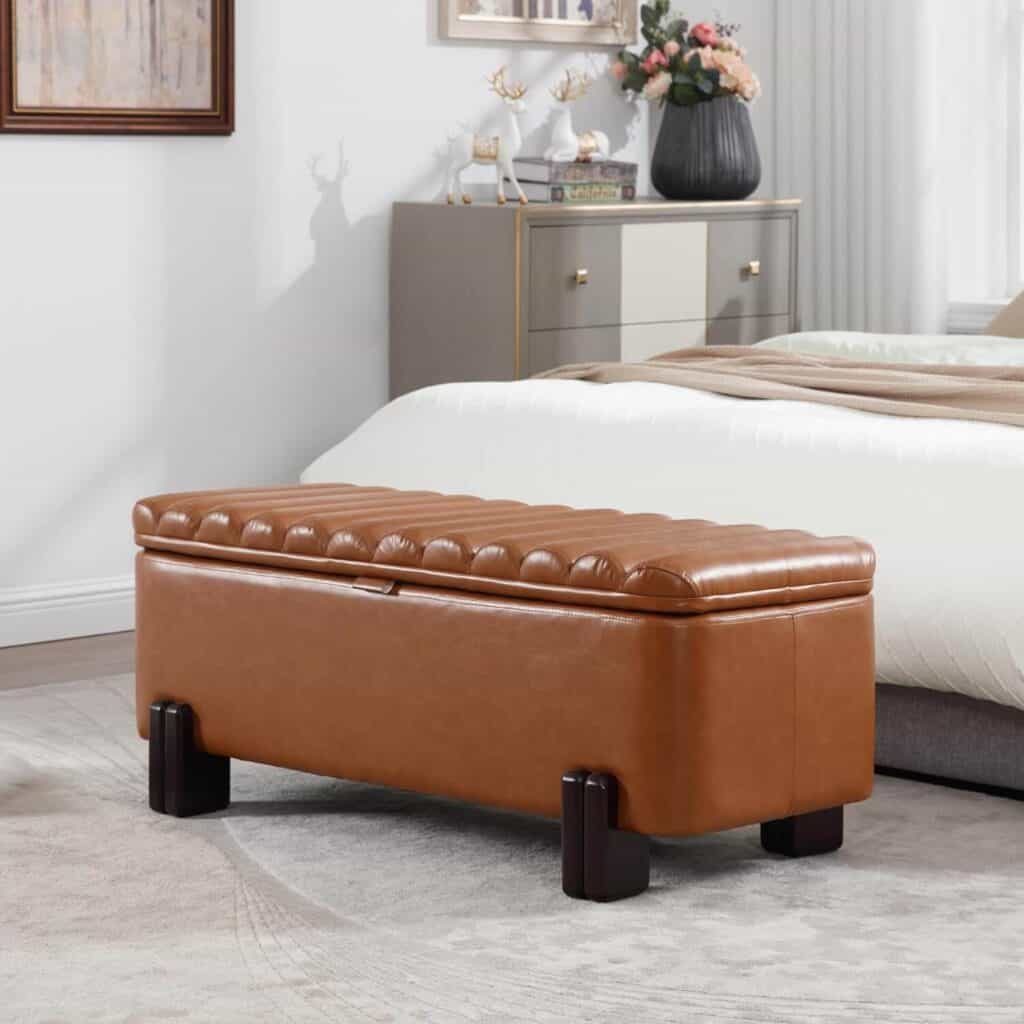 A leather ottoman with storage that works well at the end of the bed or against a wall. It's both functional and stylish.