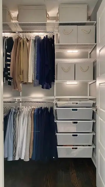 Small walk-in closet with elevated lighting