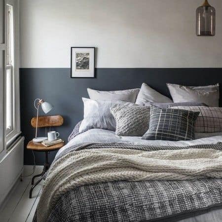 A blue, cream, and grey pattern bed for a couples' bedroom.