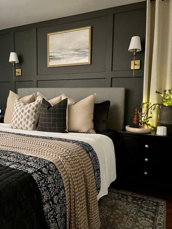 A couples bedroom with patterned bedding. Here quilts and throw pillows are coordinatd and layered beautifully.