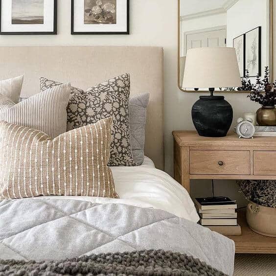 Patterned throw pillows with neutral tones for master bedroom.