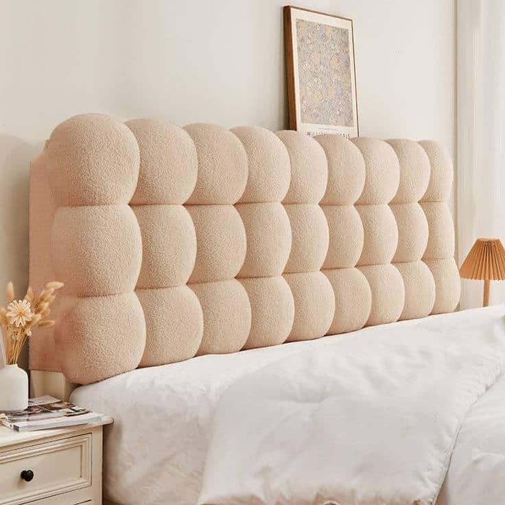Neutral tufted headboard for married couples' bedroom