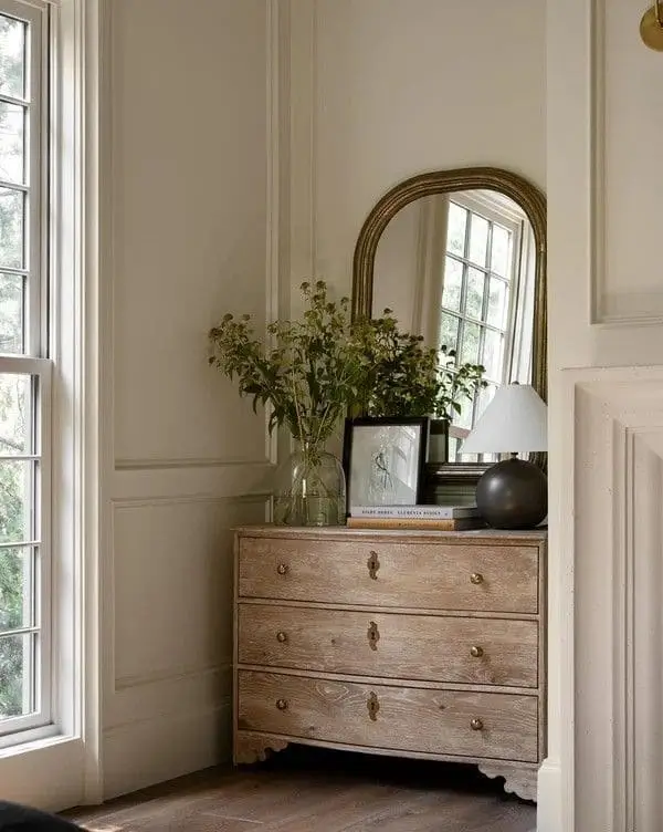Natural wood dresser brings natural element to women's master bedroom