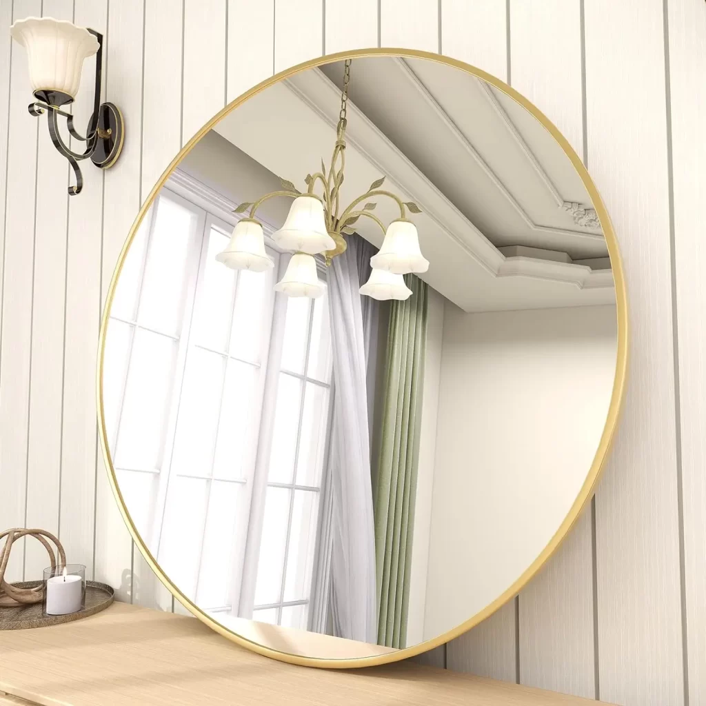 Gold rimmed circle mirror for women's bedroom