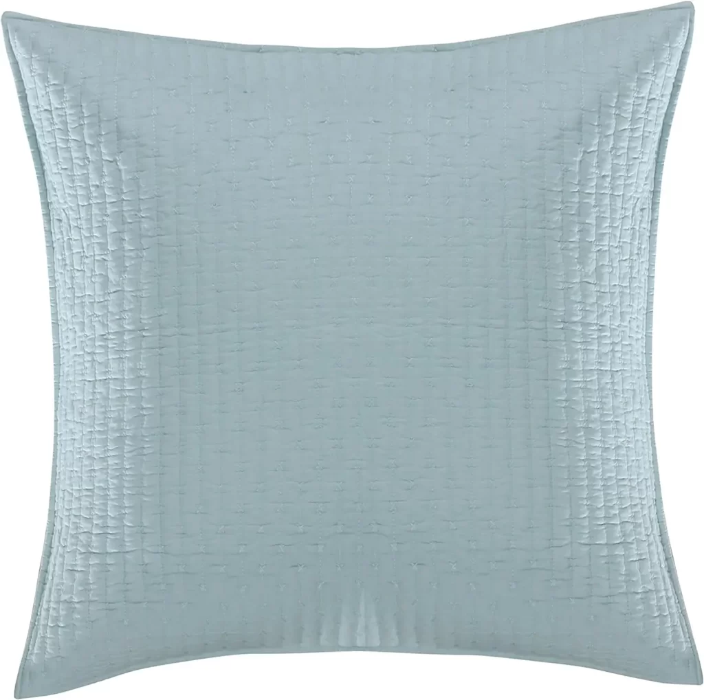 Light blue throw pillows for coastal retreat bedroom