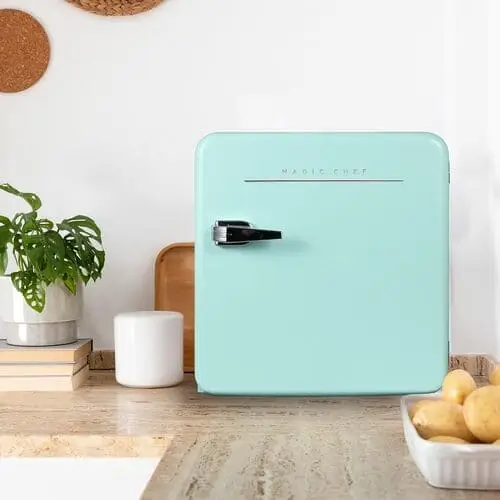 Small retro mini fridge is perfect for keeping small essentials cold, like yogurts, fruits, and beverages.