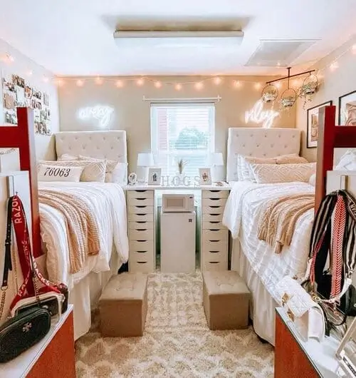 Image of a sleek mini fridge in a cozy dorm room, stocked with snacks and drinks, next to a stylish desk and bed.