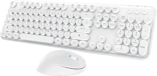 Wireless keyboard and mouse setup on a dorm room desk, providing a clutter-free and flexible workspace for a college student.