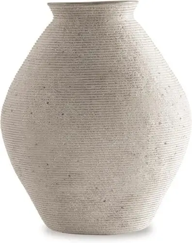 Modern farmhouse ceramic vase available on Amazon, ideal for enhancing living room decor. This elegant ceramic vase adds a rustic charm to any space, perfect for displaying fresh flowers or as a decorative accent in a neutral-toned farmhouse setting