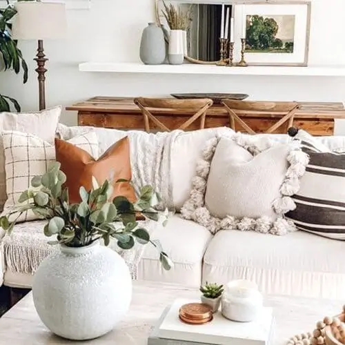 Beautiful ceramic vases in a modern farmhouse living room, adding a touch of elegance and earthy charm to the space with their simple, rustic design.