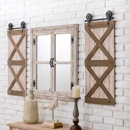 Large farmhouse barn door wall plaque set in a living room, creating a striking focal point with rustic elegance and classic farmhouse style.