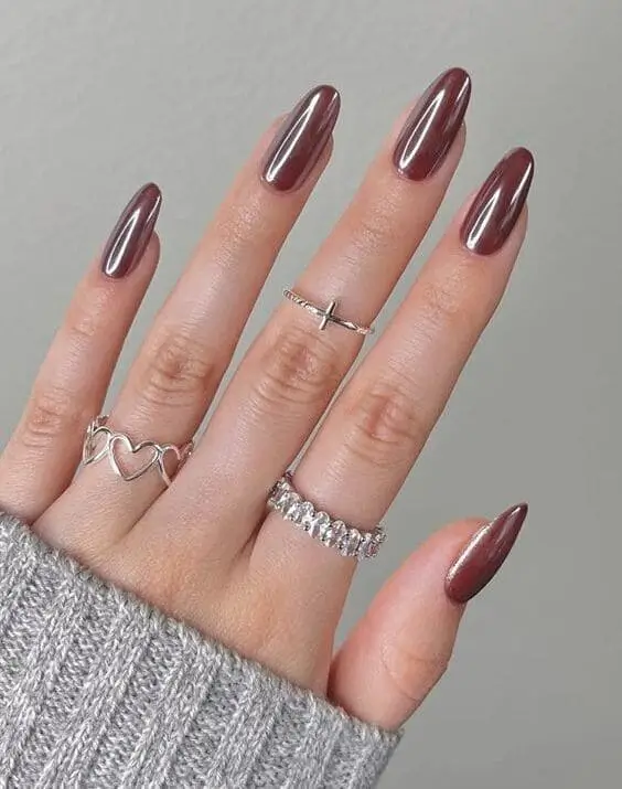 Close-up of glazed donut nails for fall, featuring a soft, pearly finish with a subtle shimmer, perfect for a chic and trendy autumn manicure.