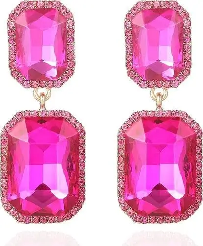 Hot pink statement earrings featuring oversized, vibrant crystals and bold geometric shapes, perfect for adding a touch of retro flair and glamour to any 80s-themed Halloween costume.