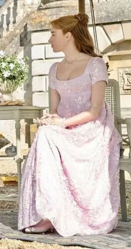 Daphne Bridgerton-inspired pink Halloween costume featuring a Regency-era gown with elegant details, including a flowing pink dress with intricate patterns and matching accessories, perfect for a sophisticated and classic look.