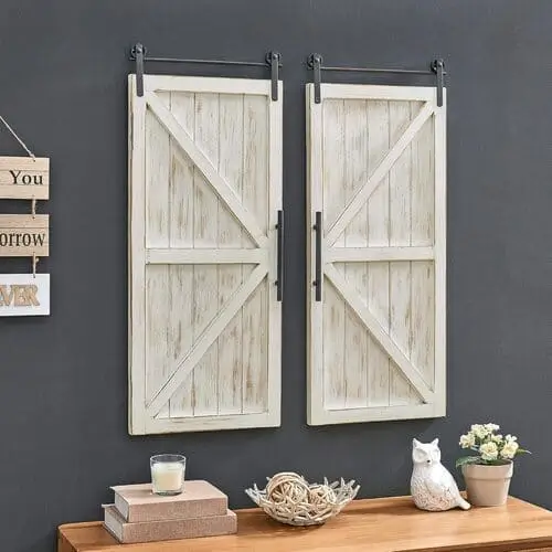 Carriage barn door wall plaque in a farmhouse living room, adding rustic charm and a touch of vintage-inspired decor.