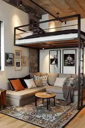 Loft bed with cozy living space below, perfect for maximizing small bedroom space with a stylish and functional design. Ideal for studio apartments and small rooms.