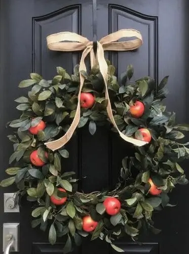 Apple orchard wreath with vibrant red apples, greenery, and rustic accents, perfect for adding a fresh, harvest-inspired touch to your fall decor and front door.