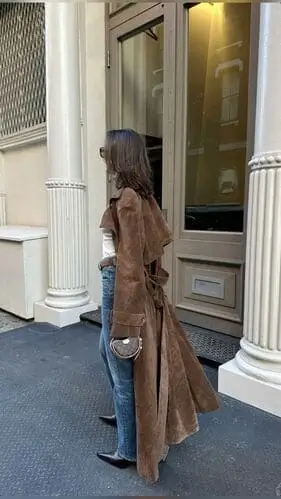 Brown suede trench coat for fall, offering a rich, textured look with warm tones. Perfect for adding a cozy, stylish touch to your autumn wardrobe, ideal for layering over casual and dressy outfits.