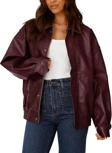 Trendy burgundy faux leather long bomber jacket for fall, featuring a sleek design and oversized fit, perfect for adding a bold and modern touch to autumn outfits.