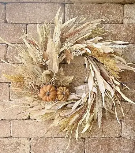 Corn husk wreath featuring natural dried husks and rustic accents, perfect for adding a farmhouse-inspired touch to your fall decor and front door.