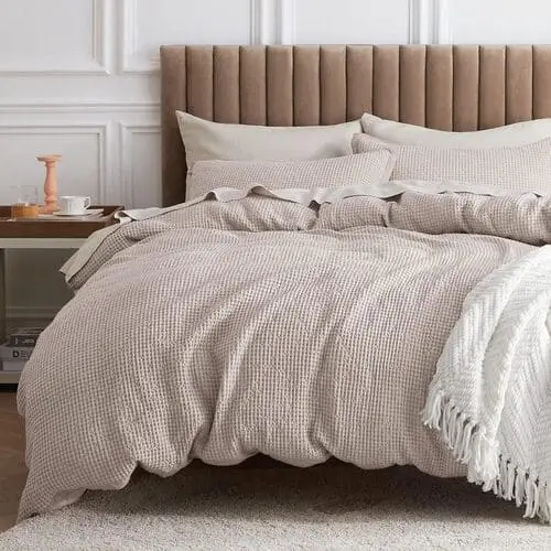 Cozy cotton waffle duvet set in neutral tones, ideal for adding texture and warmth to a living room-bedroom combo, promoting a comfortable and inviting atmosphere.