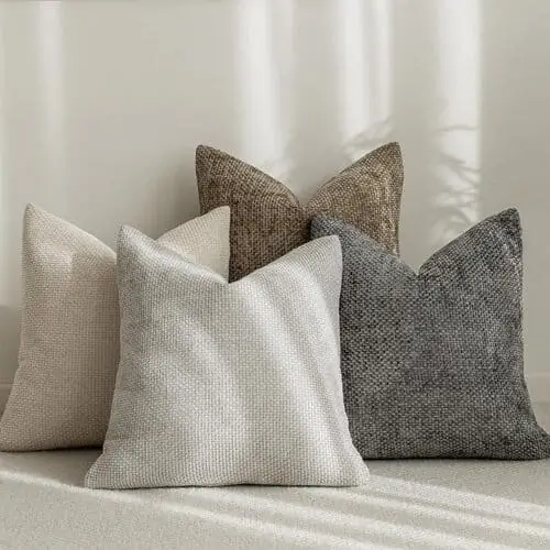 Neutral decorative throw pillow covers with subtle textures, adding warmth and a minimalist touch to any living room or bedroom. Perfect for layering and enhancing cozy vibes in neutral-toned spaces.