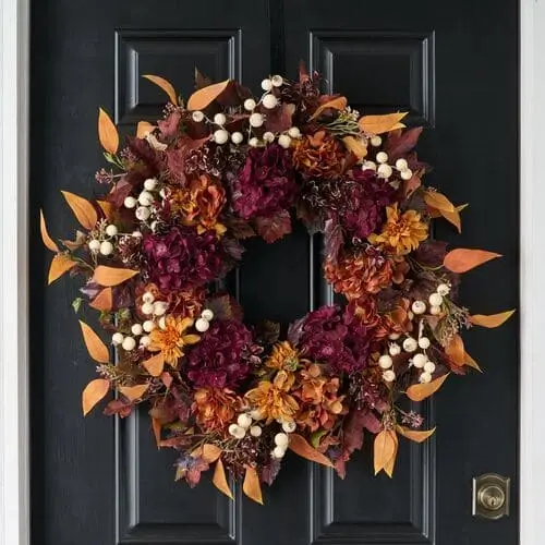 Rich hydrangea wreath featuring vibrant autumn-colored hydrangeas with lush greenery, perfect for adding an elegant, seasonal touch to your fall home decor and front door.