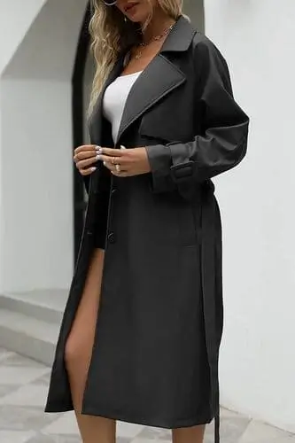 Trendy faux leather trench coat for fall featuring a sleek design, belted waist, and long sleeves, ideal for a chic and warm autumn look.