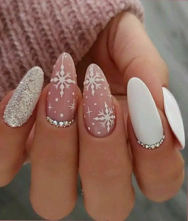 Sparkling glitter snowflake nails for Christmas 2024, featuring a frosty winter design with shimmering accents perfect for holiday nail trends.