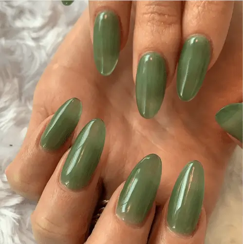 Trendy green jelly nails for fall 2024, featuring a translucent glossy finish perfect for autumn nail designs.