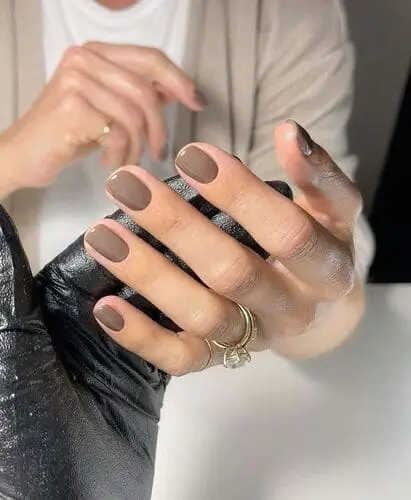 Close-up of grey nails for fall, showcasing a sleek, neutral hue ideal for a modern and understated autumn manicure