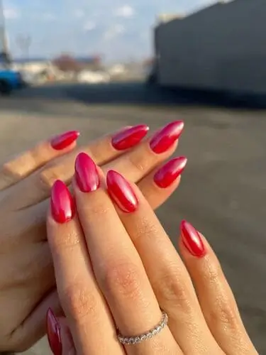 Close-up of hot pink nails for fall, featuring a bold and vibrant hue that adds a fun, unexpected pop of color to your autumn manicure.