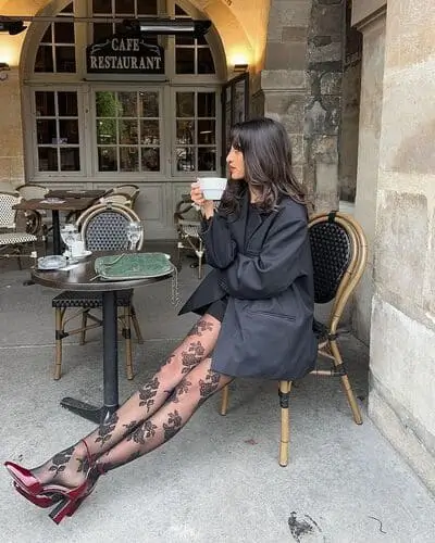 Elegant black lace statement tights for fall outfits 2024, featuring intricate patterns and a bold design, perfect for adding a chic, edgy touch to autumn looks.