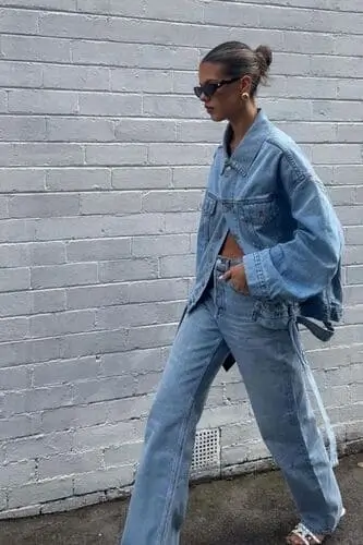 Chic light blue denim on denim outfit featuring a denim jacket and matching jeans, perfect for a casual and trendy fall look.