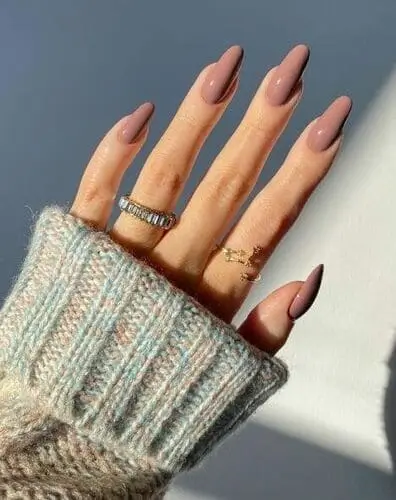 Close-up of mauve nails for fall, featuring a soft, dusty pink hue perfect for a subtle and stylish autumn manicure.