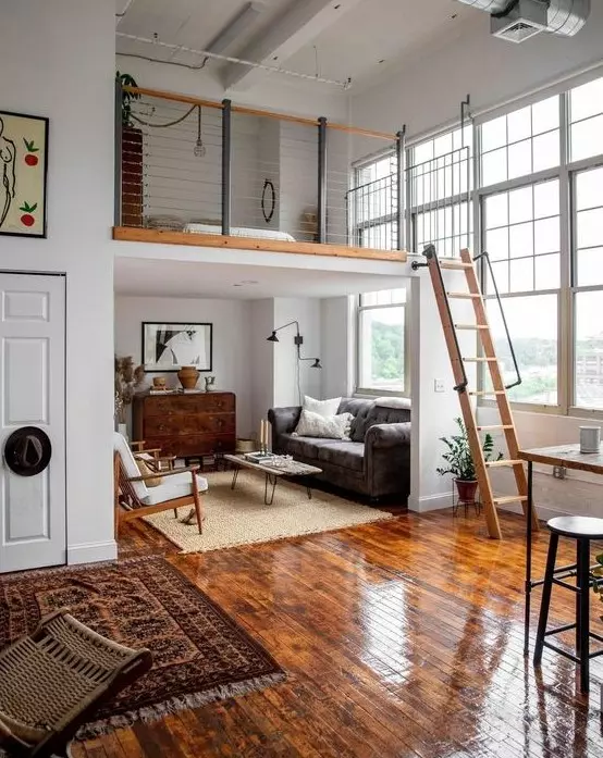 Loft bed styled with a mid-century modern living room setup below, blending sleek design and functionality for a trendy and space-saving bedroom solution.