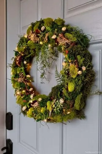 Moss-covered wreath featuring rich green texture and natural elements, perfect for adding a rustic, earthy touch to your fall or year-round home decor.