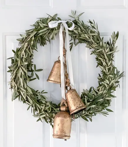 Olive wreath with bells featuring lush olive leaves and rustic metal bells, perfect for adding a natural, Mediterranean-inspired touch to your fall or year-round decor.