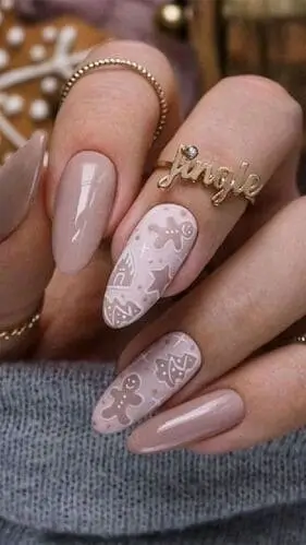 Neutral greige and pink gingerbread nails for Christmas 2024, featuring soft, festive tones and holiday-inspired accents for a chic seasonal manicure.