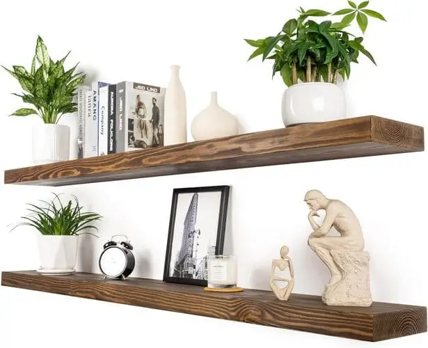 Rustic farmhouse brown floating shelves in a cozy living room bedroom combo, perfect for adding character and extra storage space. Ideal for displaying decor, books, or plants, these shelves maximize small spaces with a warm, rustic touch.