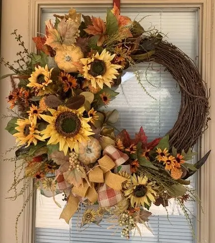 Sunflower Splendor Wreath featuring vibrant yellow sunflowers, lush greenery, and rustic accents. Perfect for brightening up your fall decor and front door.